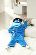 Merry Muncher onesie in blue with blue lips, worn by an adult