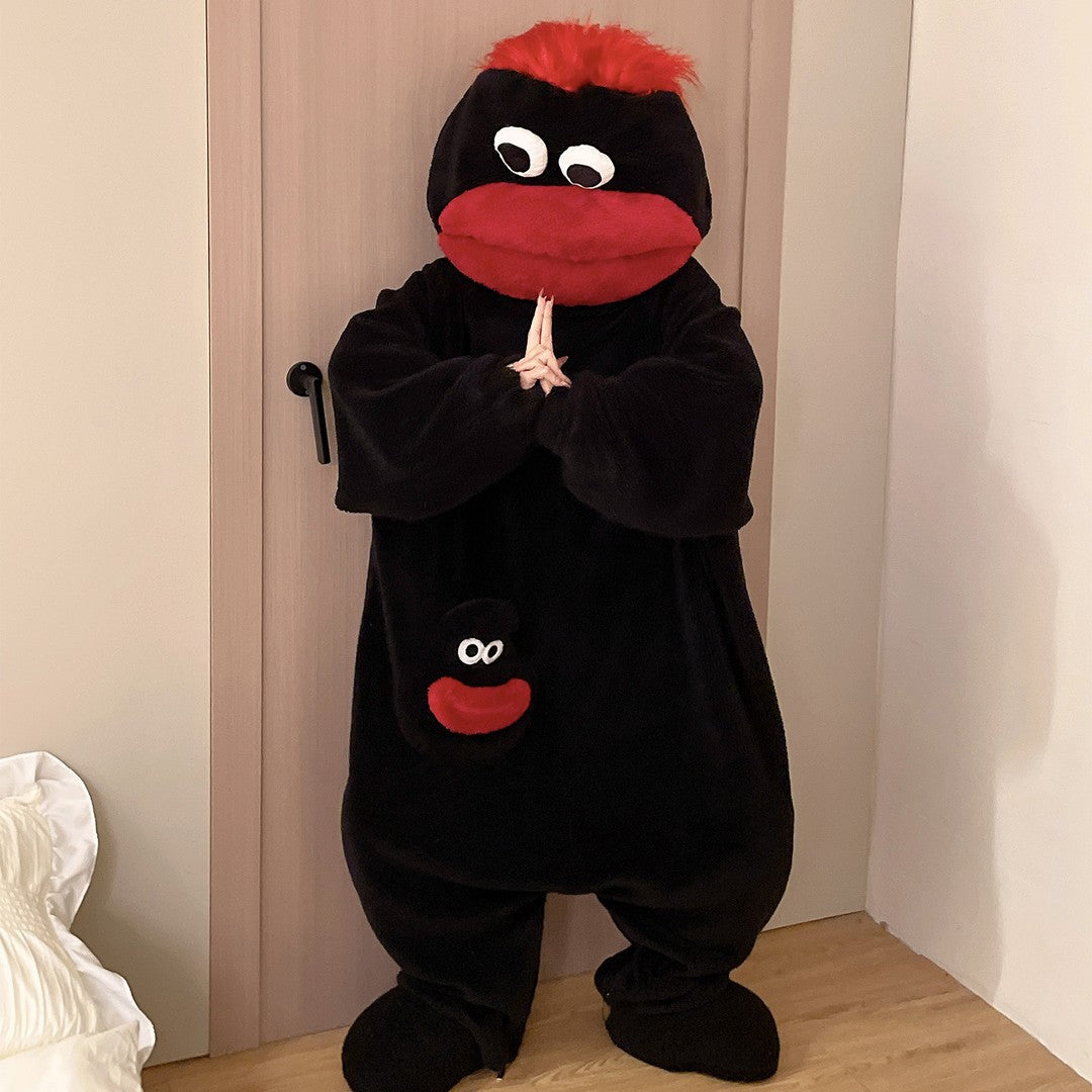 Merry Muncher onesie in Coal Black with red hair