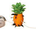 Pineapple cable organizer with orange stacked slices, green leaf top and charging plugs around it
